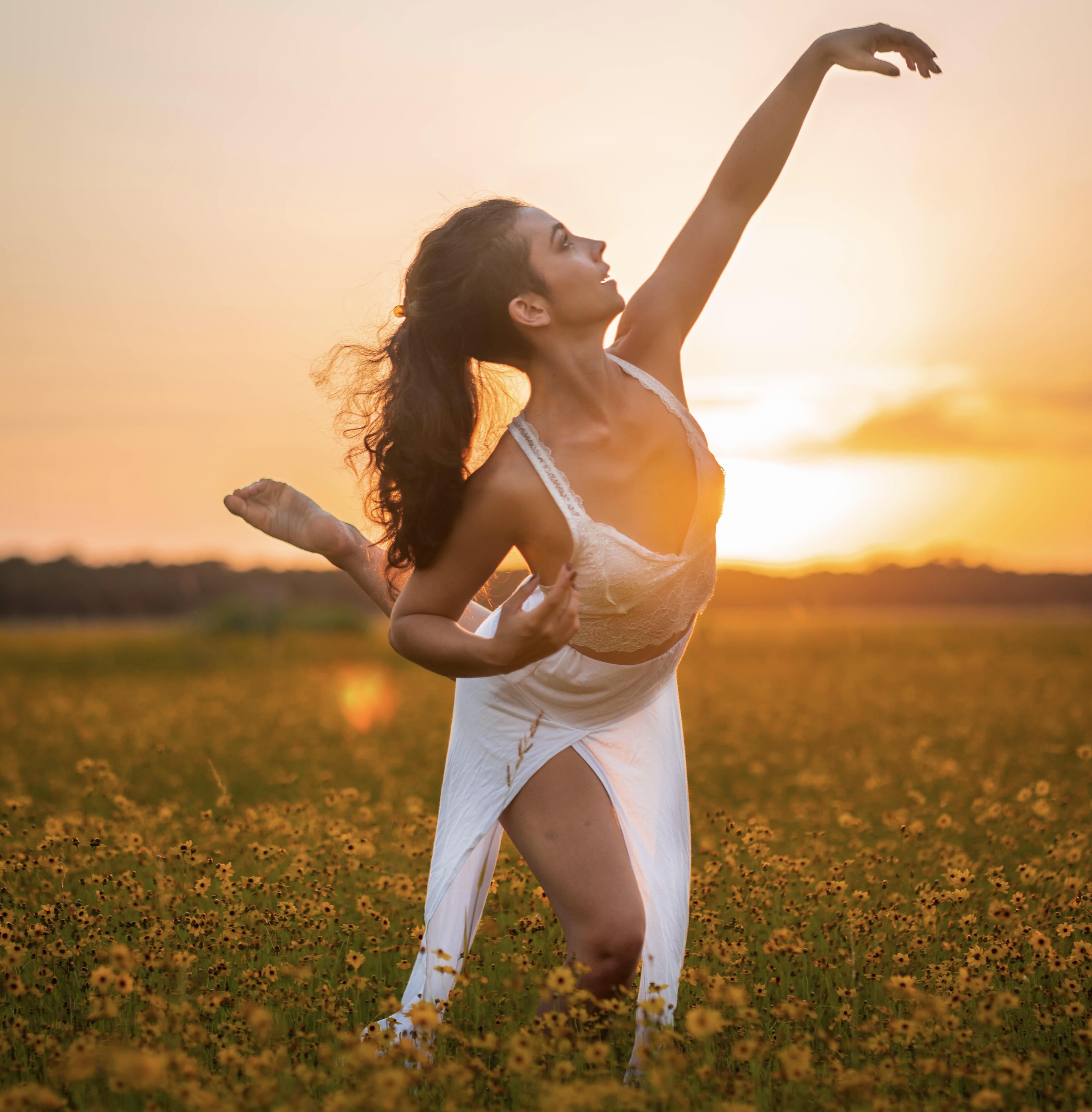 dance pose in yellow flower field